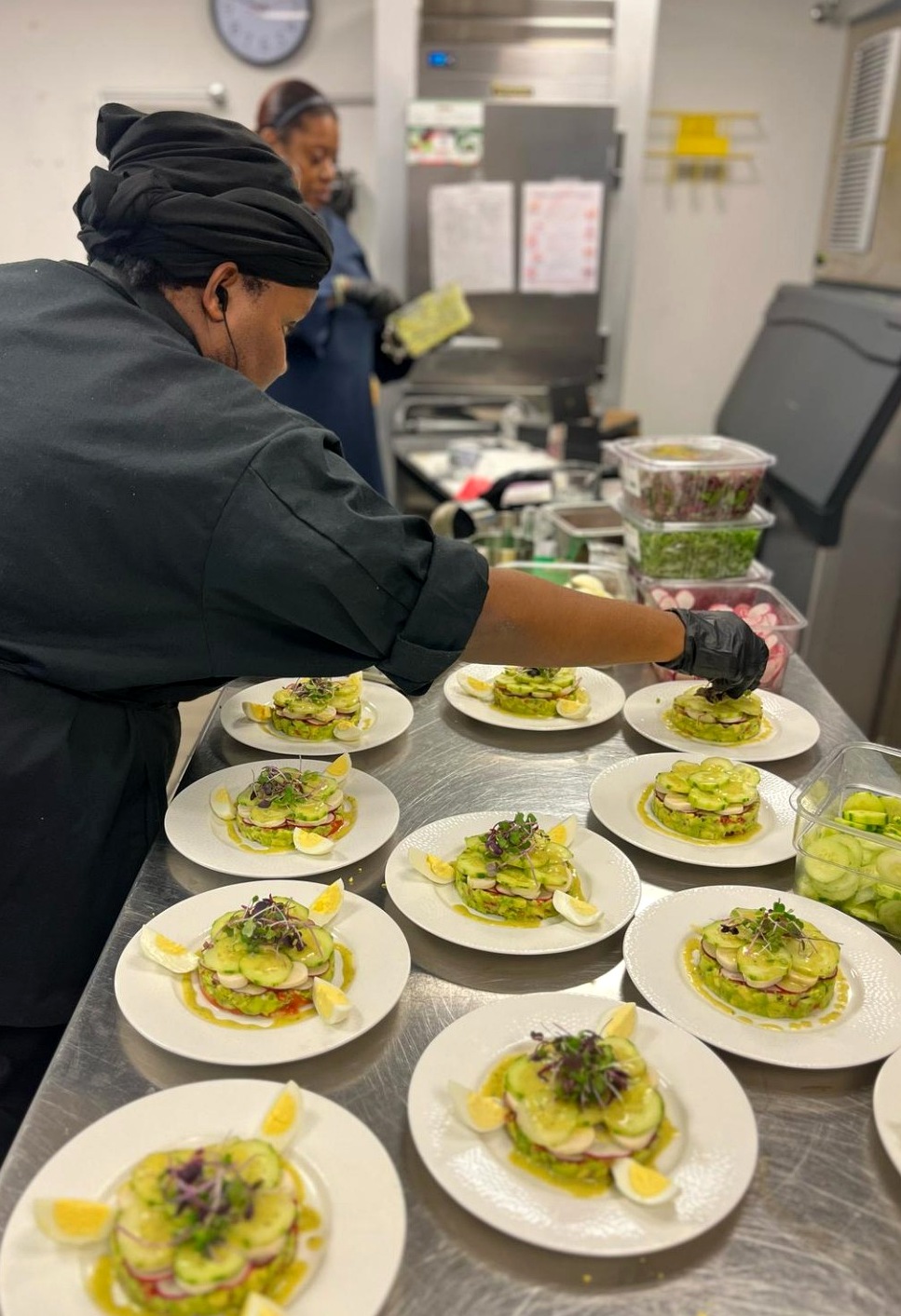 Chef precisely plating a refined culinary experience