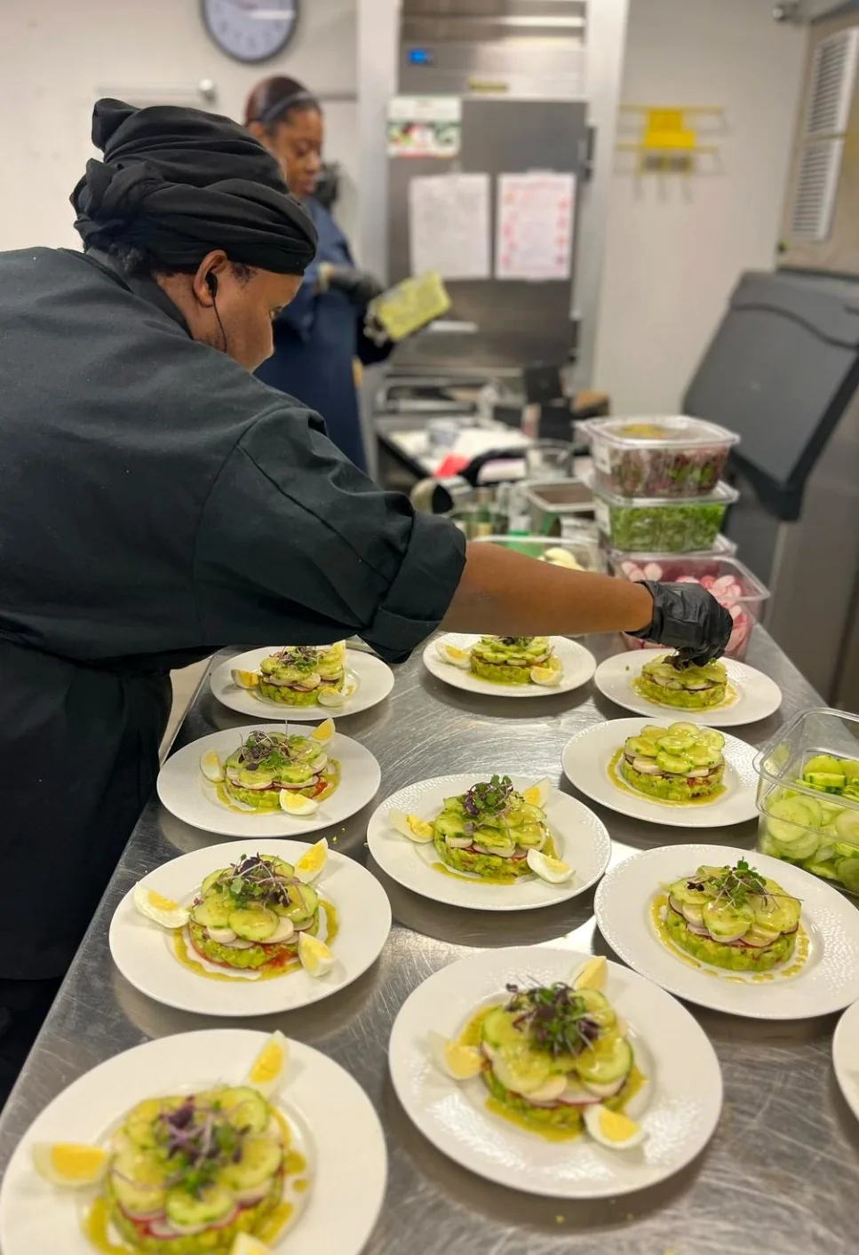 Chef precisely plating a refined culinary experience